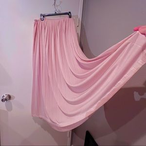 Flow-y, pleated, pale pink skirt, ready for a twirl!